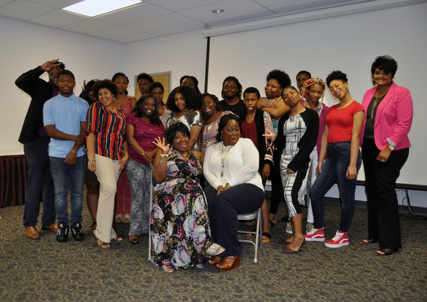 Interim Executive Director Ivory Mathews poses with the 2019 Class of Summer Youth Employment program participants as they take a ‘silly shot’.