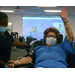 Blood donor waving to camera